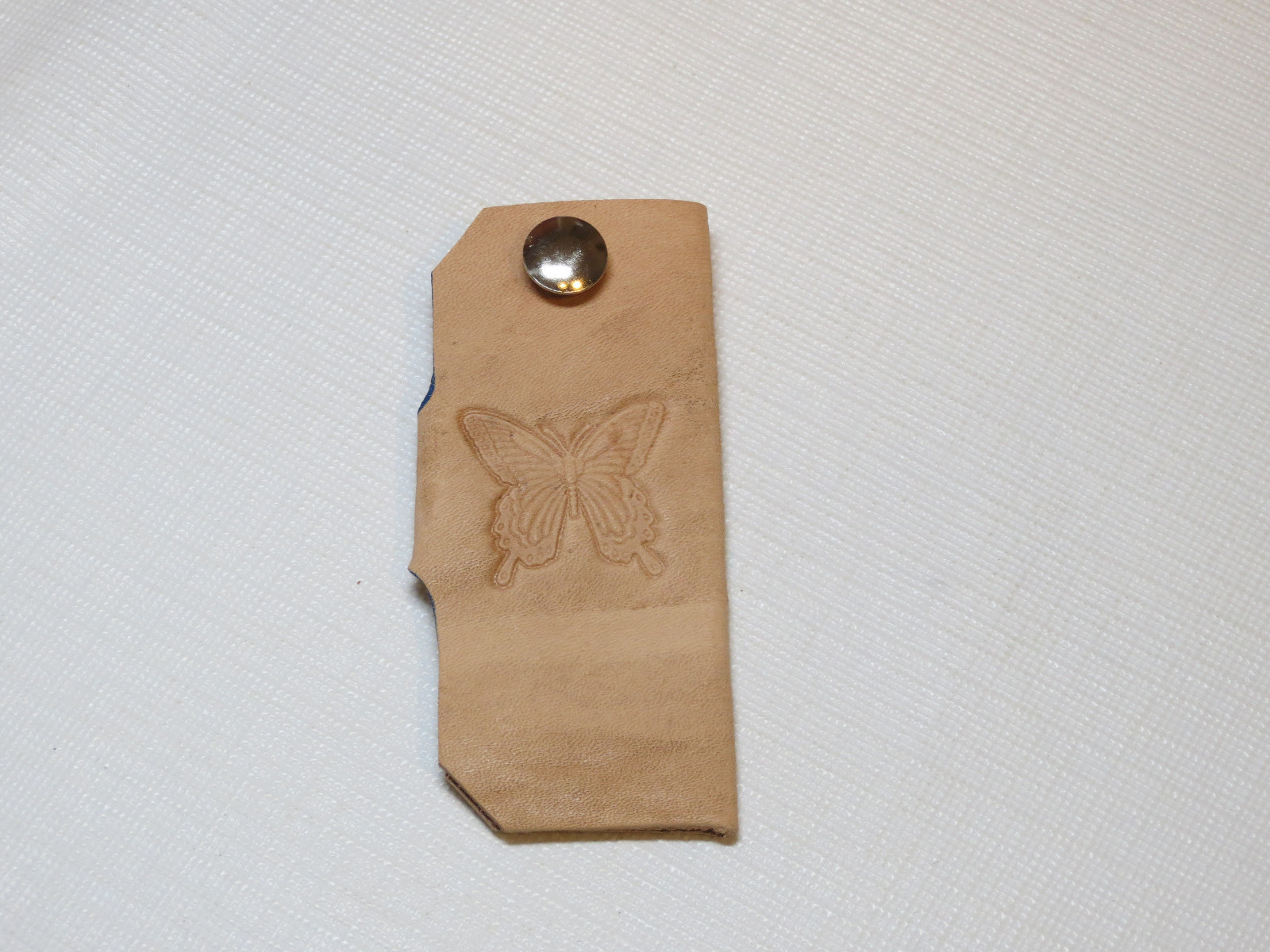 Handmade leather key holder light tan with butterfly 3.25″ X 1.5″ color varies